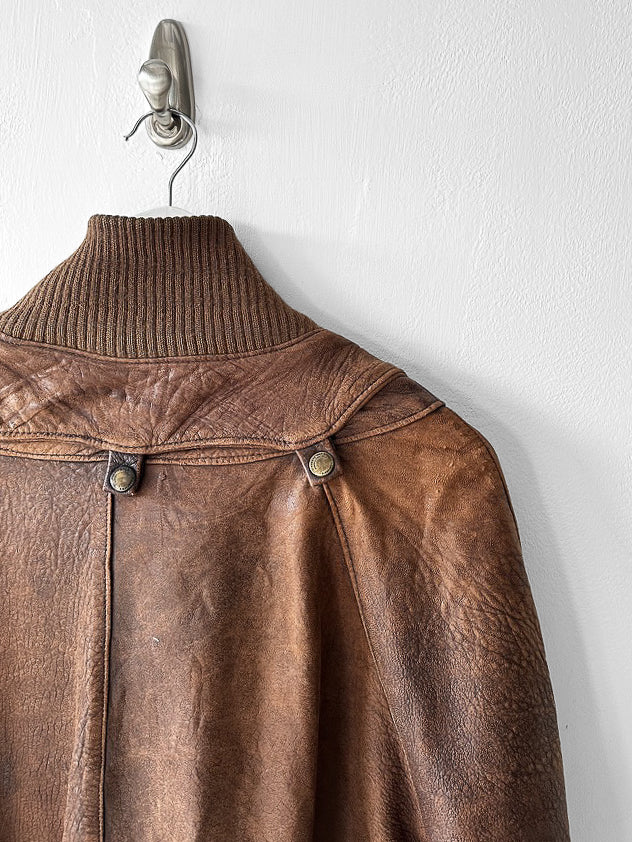 MARITHÉ & FRANÇOIS GIRBAUD X COMPAGNIE DES MONTAGNES & DES FORÊTS - 1980s DISTRESSED LEATHER BOMBER JACKET WITH HIGH RIBBED NECK