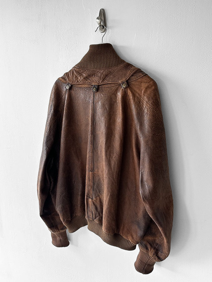 MARITHÉ & FRANÇOIS GIRBAUD X COMPAGNIE DES MONTAGNES & DES FORÊTS - 1980s DISTRESSED LEATHER BOMBER JACKET WITH HIGH RIBBED NECK