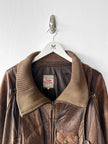 MARITHÉ & FRANÇOIS GIRBAUD X COMPAGNIE DES MONTAGNES & DES FORÊTS - 1980s DISTRESSED LEATHER BOMBER JACKET WITH HIGH RIBBED NECK