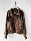 MARITHÉ & FRANÇOIS GIRBAUD X COMPAGNIE DES MONTAGNES & DES FORÊTS - 1980s DISTRESSED LEATHER BOMBER JACKET WITH HIGH RIBBED NECK