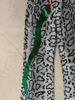 SNAKE PRINT FLARED LEG TROUSERS