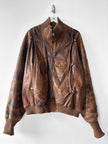 MARITHÉ & FRANÇOIS GIRBAUD X COMPAGNIE DES MONTAGNES & DES FORÊTS - 1980s DISTRESSED LEATHER BOMBER JACKET WITH HIGH RIBBED NECK