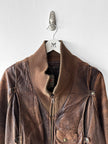 MARITHÉ & FRANÇOIS GIRBAUD X COMPAGNIE DES MONTAGNES & DES FORÊTS - 1980s DISTRESSED LEATHER BOMBER JACKET WITH HIGH RIBBED NECK