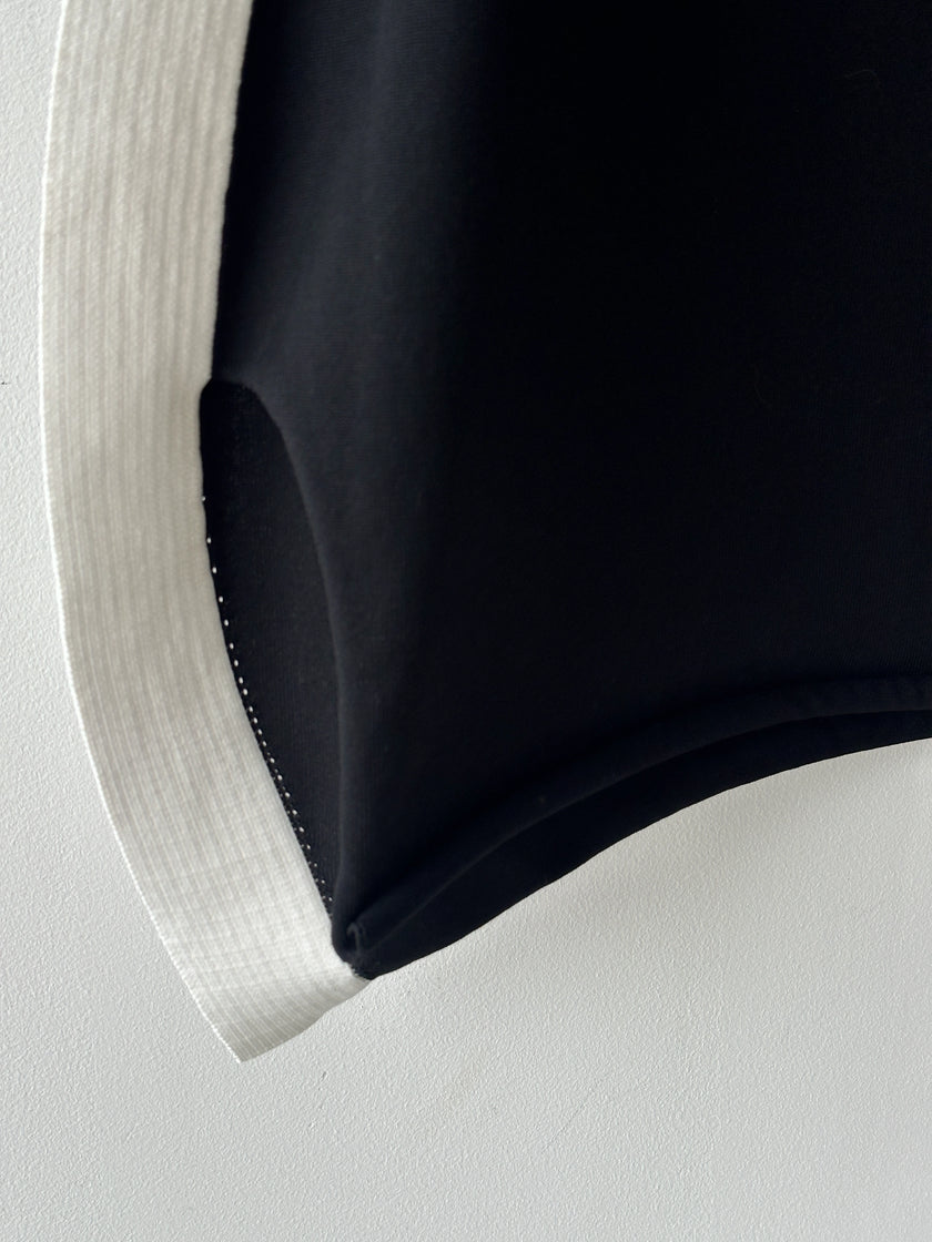 ISSEY MIYAKE -  F/W 2023 SCULPTURAL SKIRT WITH CURVED SIDE PANELS