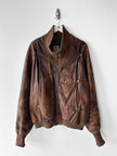 MARITHÉ & FRANÇOIS GIRBAUD X COMPAGNIE DES MONTAGNES & DES FORÊTS - 1980s DISTRESSED LEATHER BOMBER JACKET WITH HIGH RIBBED NECK