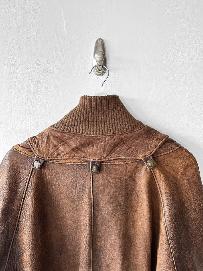 MARITHÉ & FRANÇOIS GIRBAUD X COMPAGNIE DES MONTAGNES & DES FORÊTS - 1980s DISTRESSED LEATHER BOMBER JACKET WITH HIGH RIBBED NECK